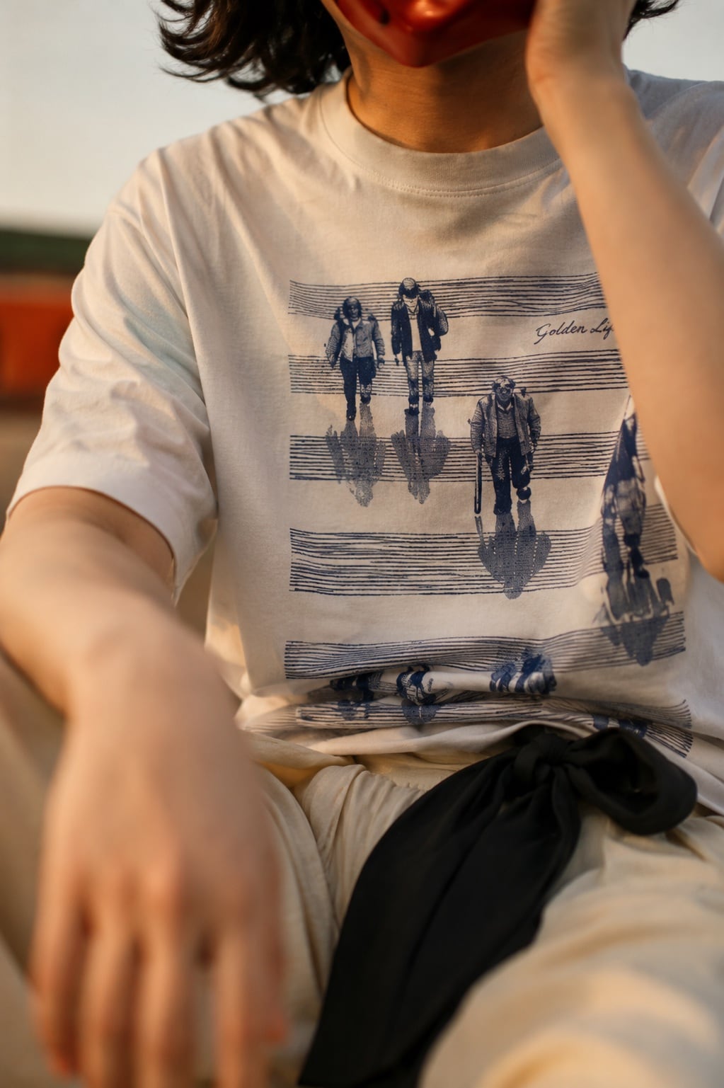 Close-up of the white graphic T-shirt print