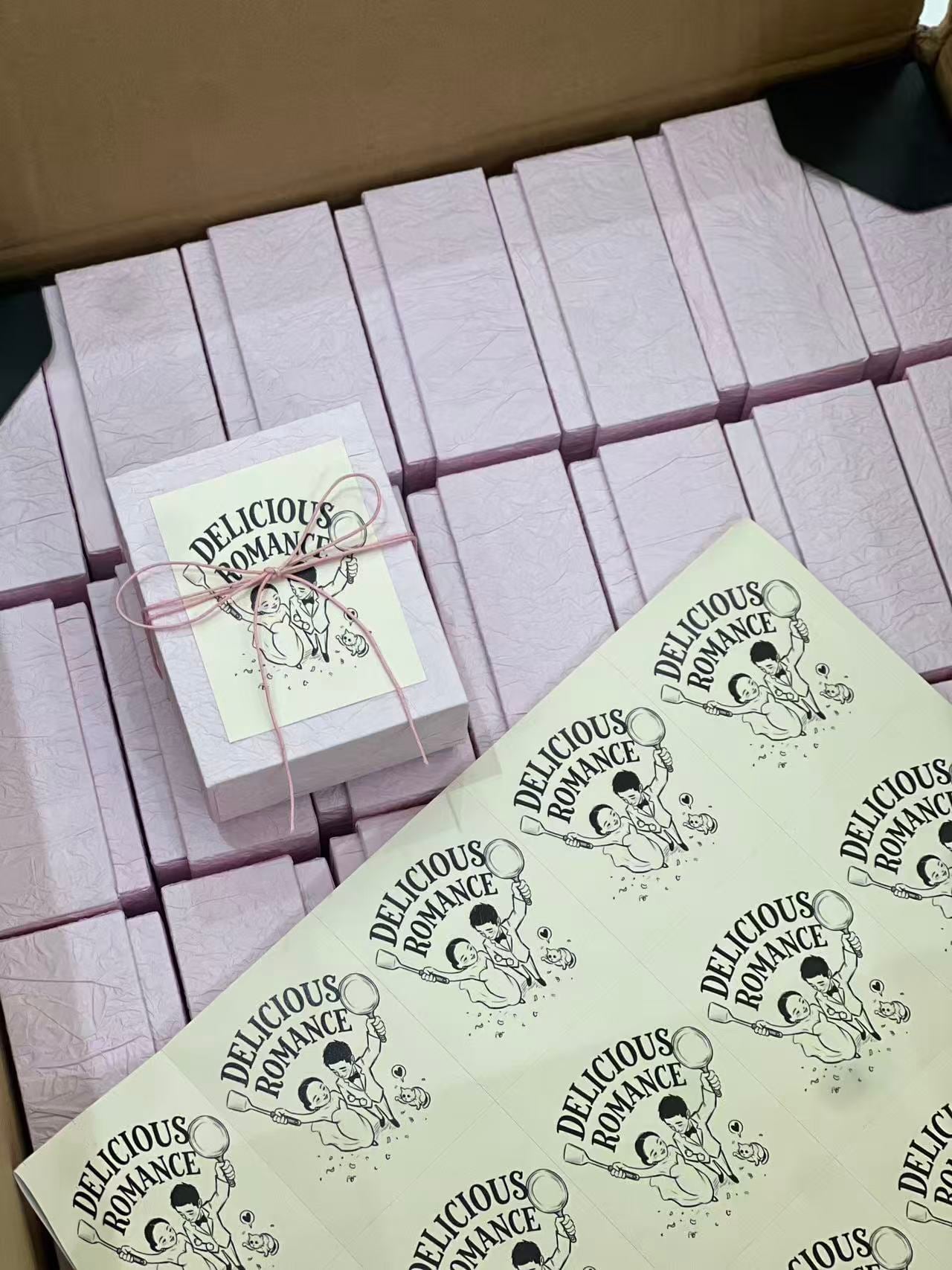 Finished wedding favor boxes with Delicious Romance labels